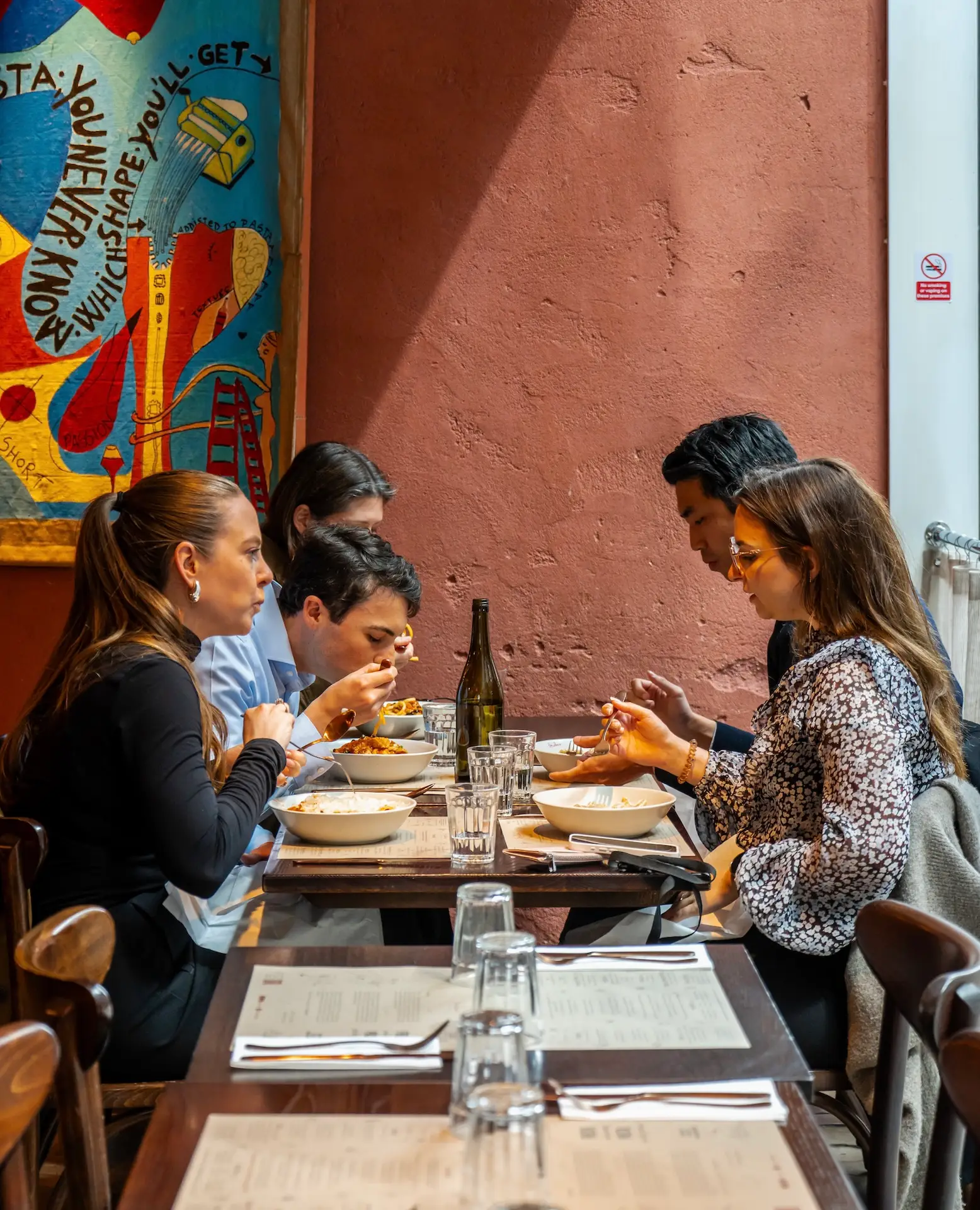 Friends dining together at Emilia's